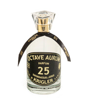 A bottle of OCTAVE AURUM 25 perfume with a black label, clear text, and a decorative black ribbon around the neck.